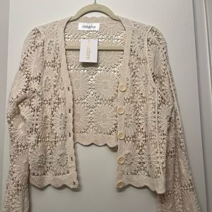 Cream sweater with pearls, crochet design